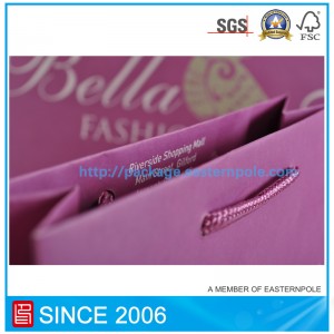 Sac en papier violet avec poignée nouée